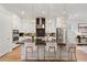 Modern kitchen with white cabinets, marble countertops, and stainless steel appliances at 2200 Cortland Rd, Milton, GA 30009