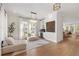 Bright living room featuring hardwood floors, modern lighting, and a convenient wet bar at 2200 Cortland Rd, Milton, GA 30009