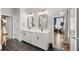 Bathroom featuring double vanity, modern fixtures, and a doorway leading to the main bedroom at 2200 Cortland Rd, Milton, GA 30009