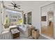 Covered porch with comfortable seating, ceiling fan, and an indoor-outdoor living experience at 2200 Cortland Rd, Milton, GA 30009