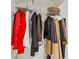 Custom closet with shelving and hanging rods to keep clothing organized and accessible at 3481 Lakeside Ne Dr # 2203, Atlanta, GA 30326