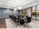 Well-lit conference room with a large table, comfortable chairs, and city views at 3481 Lakeside Ne Dr # 2203, Atlanta, GA 30326