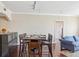 Dining area open to the kitchen and living room with hardwood floors and seating for four at 3481 Lakeside Ne Dr # 2203, Atlanta, GA 30326