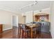 Dining area with seating for four features an adjacent kitchen and hardwood floors at 3481 Lakeside Ne Dr # 2203, Atlanta, GA 30326