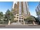 High-rise condo building with a gated entrance, professionally landscaped surroundings, and beautiful balconies at 3481 Lakeside Ne Dr # 2203, Atlanta, GA 30326