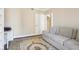 A large light gray sofa and rug provide comfortable seating to read at 3481 Lakeside Ne Dr # 2203, Atlanta, GA 30326