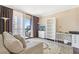 Cozy living room with carpet, balcony access, and city views at 3481 Lakeside Ne Dr # 2203, Atlanta, GA 30326