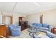Open-concept living room boasts hardwood floors, neutral walls, and stylish furniture with a view to the kitchen at 3481 Lakeside Ne Dr # 2203, Atlanta, GA 30326
