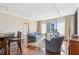 Bright living area offers hardwood floors, a large window with city views, and a dining space at 3481 Lakeside Ne Dr # 2203, Atlanta, GA 30326