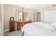 This main bedroom boasts carpeted floors, wooden furniture, and a bright window at 3481 Lakeside Ne Dr # 2203, Atlanta, GA 30326