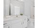Bathroom with marble vanity top, white cabinets, and tile floors at 545 Slane Trce, Roswell, GA 30076