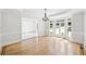 A formal dining room with hardwood floors, large bay windows, and elegant trim at 545 Slane Trce, Roswell, GA 30076
