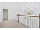 Bright hallway boasts a chandelier and a view through the large arched window at 545 Slane Trce, Roswell, GA 30076