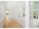 Open concept living room area featuring high ceilings, large windows, fireplace, and elegant white pillars at 545 Slane Trce, Roswell, GA 30076