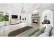 Spacious main bedroom suite offers a fireplace, decorative ceiling, chandelier, and lots of natural light at 545 Slane Trce, Roswell, GA 30076