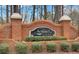 Brick entrance sign with 'Sentinel on the River' name, showcasing the community's established and welcoming appeal at 545 Slane Trce, Roswell, GA 30076
