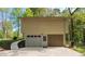 Two-car garage offers ample parking and storage space, complemented by stone facade at 904 Little River Ln, Woodstock, GA 30189