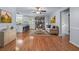 Cozy living room with hardwood floors, fireplace, and open access to the modern kitchen at 904 Little River Ln, Woodstock, GA 30189