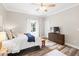 Cozy bedroom with hardwood floors, TV and a large window to enjoy the view at 13 E Palmetto St, Porterdale, GA 30014