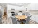 Eat-in kitchen features granite countertops, stainless steel appliances, and hardwood floors at 13 E Palmetto St, Porterdale, GA 30014