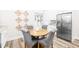 Eat-in kitchen features granite countertops, stainless steel appliances, and hardwood floors at 13 E Palmetto St, Porterdale, GA 30014