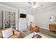 Inviting living room boasts hardwood floors, recessed lighting, and plenty of natural light at 13 E Palmetto St, Porterdale, GA 30014