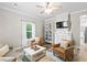 Inviting living room with hardwood floors, recessed lighting, and ample natural light at 13 E Palmetto St, Porterdale, GA 30014