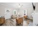 Inviting living room with modern flooring, neutral paint, and a cozy seating arrangement at 13 E Palmetto St, Porterdale, GA 30014