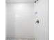 Elegant walk-in shower with white tile and decorative accent for a spa-like experience at 13 E Palmetto St, Porterdale, GA 30014