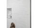 Close up of the shower featuring white subway tile and a gold fixture at 13 E Palmetto St, Porterdale, GA 30014