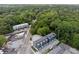 An aerial view of the luxury townhomes in a quiet neighborhood surrounded by mature trees at 1570 Flat Shoals Se Rd # 4, Atlanta, GA 30316