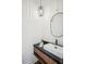Modern bathroom featuring a stylish sink with elegant mirror and a chic light fixture at 1570 Flat Shoals Se Rd # 4, Atlanta, GA 30316
