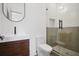 Modern bathroom featuring a walk-in shower with glass door and a stylish sink vanity with wood accents at 1570 Flat Shoals Se Rd # 4, Atlanta, GA 30316