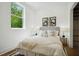 Cozy bedroom with a large window, stylish decor, and comfortable furnishings at 1570 Flat Shoals Se Rd # 4, Atlanta, GA 30316