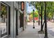 Street-side view of a vintage building with storefront windows and a neon 'BAR' sign at 1570 Flat Shoals Se Rd # 4, Atlanta, GA 30316