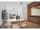 Bright dining room features a white table, hardwood floors and an open-concept design at 1570 Flat Shoals Se Rd # 4, Atlanta, GA 30316