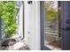 Exterior of a house with a white brick wall, gray trim, and a small tree in the landscaping at 1570 Flat Shoals Se Rd # 4, Atlanta, GA 30316