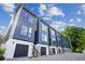 Modern townhouse complex boasting large windows and individual garages at 1570 Flat Shoals Se Rd # 4, Atlanta, GA 30316