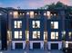 Modern townhome showcasing sleek design with private balconies, garages, and contemporary lighting at 1570 Flat Shoals Se Rd # 4, Atlanta, GA 30316