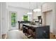 Modern kitchen features a large island with seating, stainless appliances, and natural light at 1570 Flat Shoals Se Rd # 4, Atlanta, GA 30316