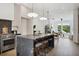 Modern kitchen featuring a marble island with seating, stainless steel appliances, and natural light at 1570 Flat Shoals Se Rd # 4, Atlanta, GA 30316