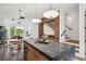 Open floor plan reveals a modern kitchen with an island, dining area, and staircase at 1570 Flat Shoals Se Rd # 4, Atlanta, GA 30316