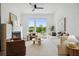 Bright living room with fireplace, hardwood floors, and large windows offering abundant natural light at 1570 Flat Shoals Se Rd # 4, Atlanta, GA 30316