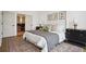 Comfortable main bedroom features wood floors and an ensuite bathroom at 1570 Flat Shoals Se Rd # 4, Atlanta, GA 30316