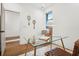 Well-lit office features hardwood floors, a clear desk with a lamp, and a window view at 1570 Flat Shoals Se Rd # 4, Atlanta, GA 30316