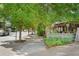 A street view of the neighborhood showcasing the walkable sidewalks and established local businesses at 1570 Flat Shoals Se Rd # 4, Atlanta, GA 30316