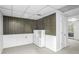Finished basement area with painted wood paneling, a door, and bright white storage shelf at 3073 Henderson Mill Rd, Atlanta, GA 30341