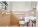 Classic bathroom featuring a toilet, and a sink with tile backsplash at 3073 Henderson Mill Rd, Atlanta, GA 30341