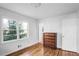 Bright bedroom with hardwood floors, a large window and light paint at 3073 Henderson Mill Rd, Atlanta, GA 30341