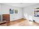 A sunlit bedroom with hardwood flooring and two large windows providing natural light at 3073 Henderson Mill Rd, Atlanta, GA 30341